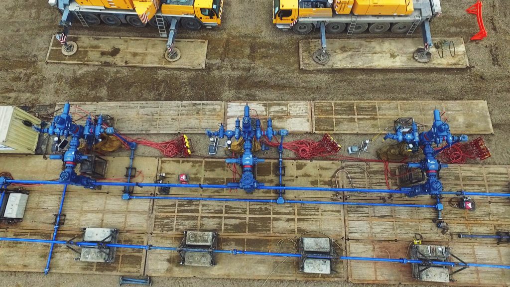 Aerial view of wellhead equipment and completions solutions in the field